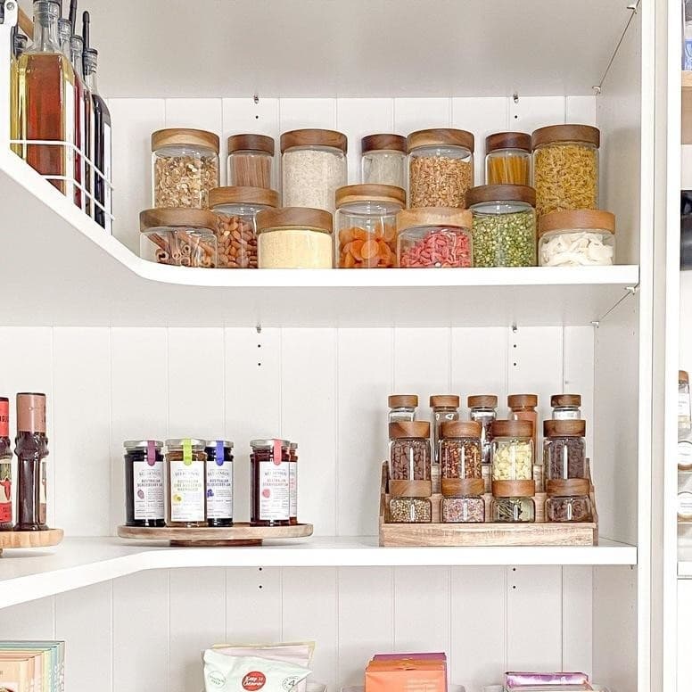 Organized pantry with glass storage jars
